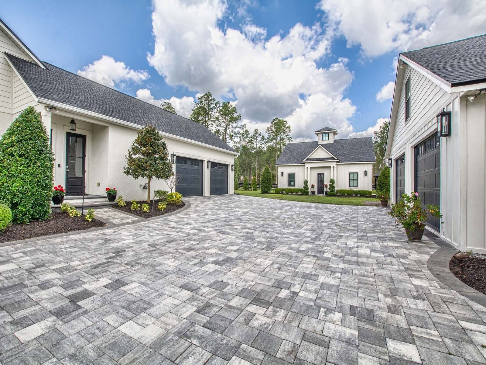 Custom home courtyard and paver driveway